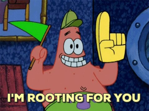 A still frame from the animated series SpongeBob SquarePants featuring the character Patrick Star. Patrick is pink, has a smiling expression with large teeth, and is wearing a green hat. He is holding a small green flag in his right hand and has his left hand raised with a finger pointing upward in a gesture of encouragement. The background is colorful and stylized, consistent with the show's animation style.