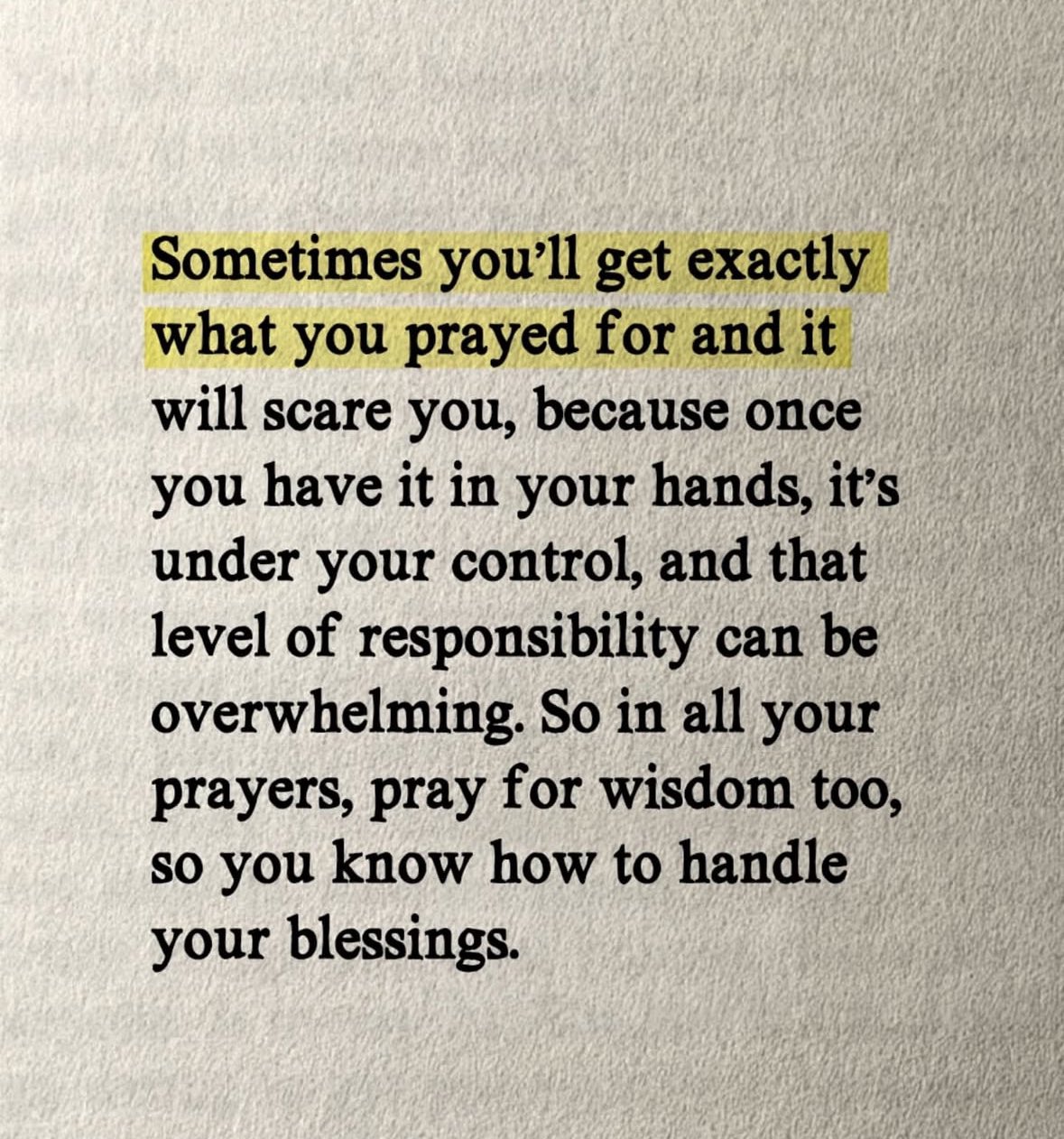 A close-up photograph of a printed quote on textured, off-white paper. The first two lines of the text are highlighted with a yellow marker. The font is a black, serif typeface.