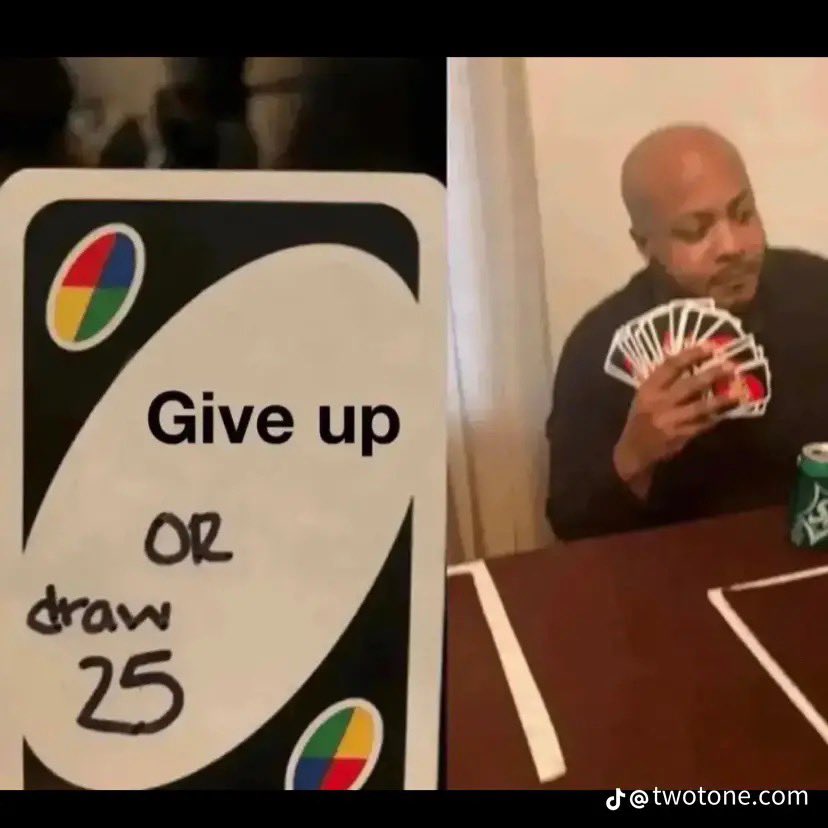 A split-screen image. On the left, there is a close-up of a playing card that features colorful circular icons in the corners and the text 'Give up OR draw 25'. On the right, there is a video still of a man with a shaved head, wearing a black shirt, holding a large fan of playing cards up to his mouth as if he is about to eat them. The background shows a domestic setting with a curtain and a table. There is a watermark at the bottom right corner.