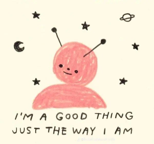 A simple, hand-drawn illustration on an off-white background. The central figure is a pink, rounded character with two antennae, two eyes, and a small smile, resembling a friendly alien. Surrounding the character are various black hand-drawn celestial symbols, including stars, a crescent moon, and a planet with a ring. At the bottom, there is handwritten-style text that reads 'I'M A GOOD THING JUST THE WAY I AM'.