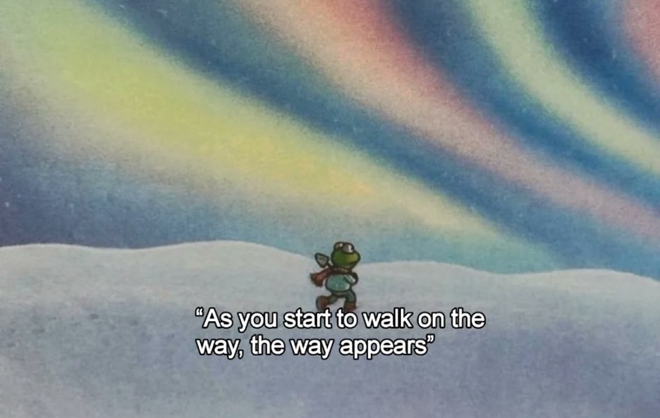 A digital illustration featuring a small, stylized green character with a backpack walking across a snowy or white hilly landscape. Above the landscape, large, flowing, pastel-colored waves (resembling an aurora borealis or abstract sky) in shades of blue, green, pink, and yellow fill the upper half of the frame. At the bottom, there is white text overlaid on the ground.