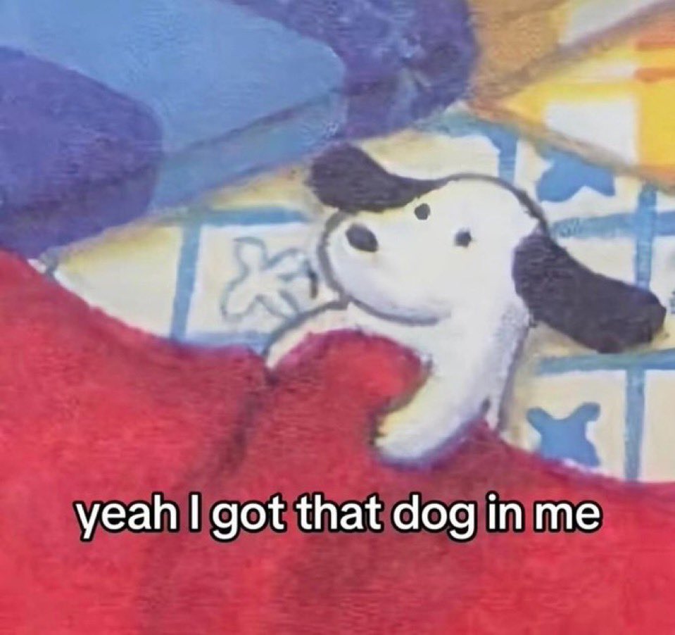A meme featuring a cartoon drawing of a white dog with black ears and spots, partially covered by a red blanket. The dog has a simple, expressive face. The background shows a patterned blue and white surface. Text is overlaid at the bottom of the image.