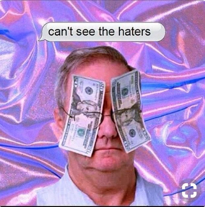A meme featuring a man's face with two one-dollar bills taped over his eyes, mimicking glasses. The background consists of shimmering, iridescent purple and blue fabric. A speech bubble at the top contains text.