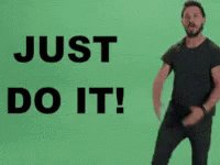 A man with dark hair and a beard is standing against a solid green background. He is wearing a dark t-shirt and dark pants. The large, bold text 'JUST DO IT!' is displayed to the left of him.