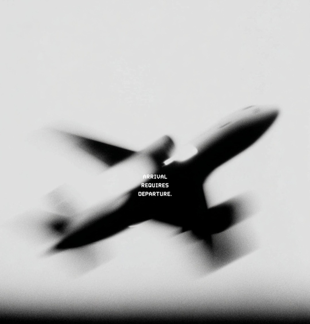 A black and white, motion-blurred photograph of an airplane in flight against a pale, overcast sky. The aircraft is captured in an upward tilt, appearing as a dark, dynamic shape. Centered over the body of the plane is the text 'ARRIVAL REQUIRES DEPARTURE.' in a clean, white, sans-serif font.