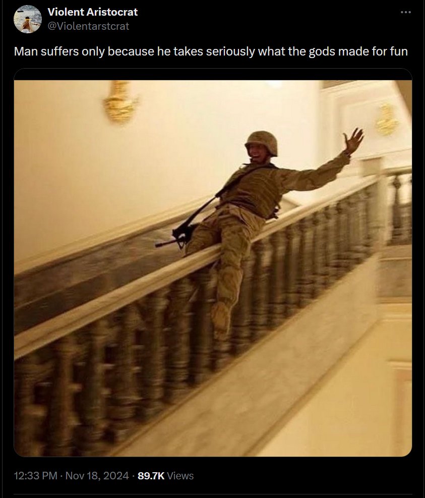 A screenshot of a tweet from a user named 'Violent Aristocrat'. The tweet contains the text 'Man suffers only because he takes seriously what the gods made for fun' above an image of a soldier in desert camouflage gear. The soldier is captured in a motion-blurred, candid moment, leaning precariously over a marble balcony railing with one arm raised in the air. The setting appears to be a large, opulent building with marble stairs and gold decor. The bottom of the image shows the timestamp '12:33 PM · Nov 18, 2024' and '89.7K Views'.