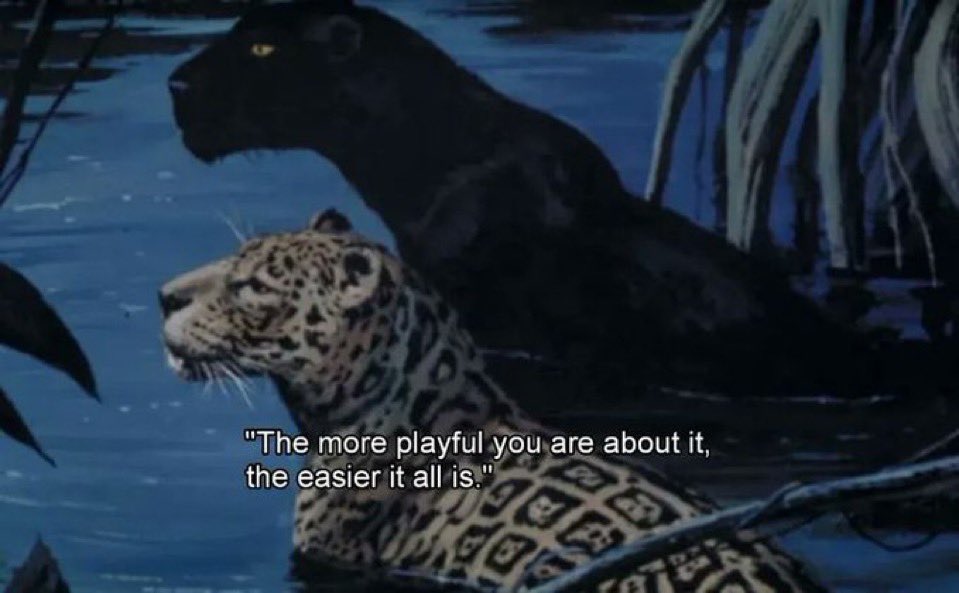 An animated scene from a movie, likely The Jungle Book, featuring two large cats in a body of water at night. In the foreground, a spotted leopard or jaguar is partially submerged, looking to the left. Behind it, a large black panther is also partially submerged, looking in the same direction. The background shows dark, silhouetted vegetation and water ripples under dim, blueish lighting. There is white text overlaid at the bottom of the image.